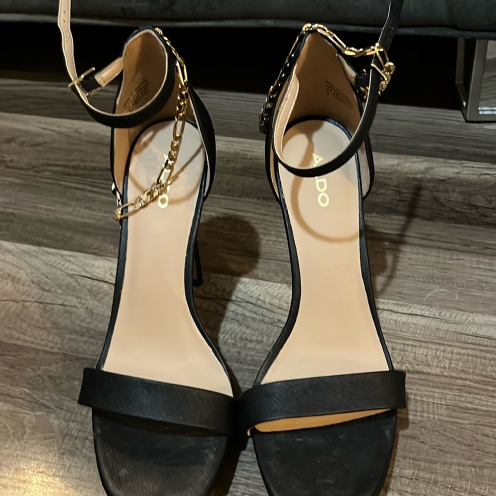 Black sandal with gold accent anklet